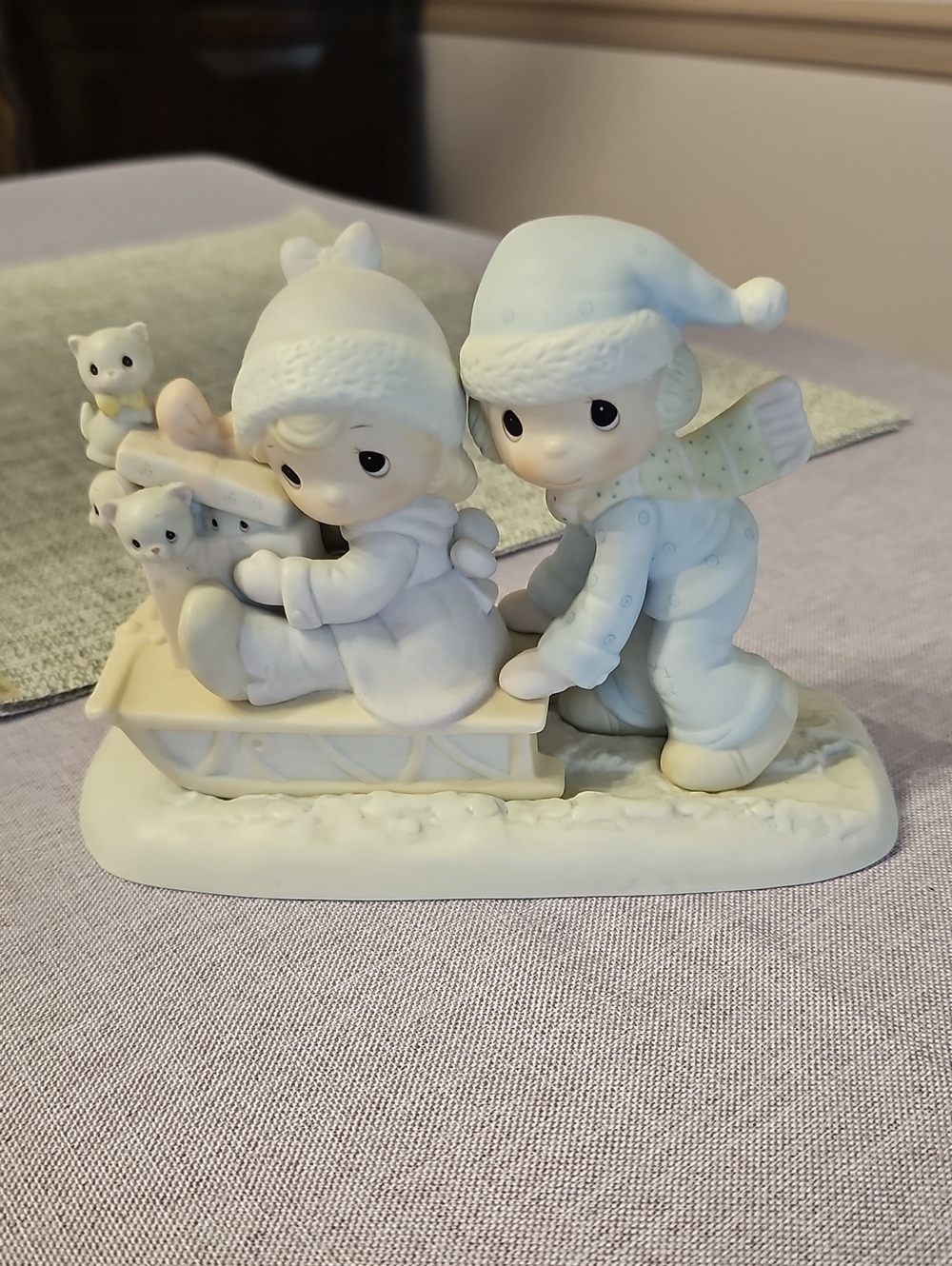 Precious Moments Pastel Blue and Cream Winter Sledding Figurine